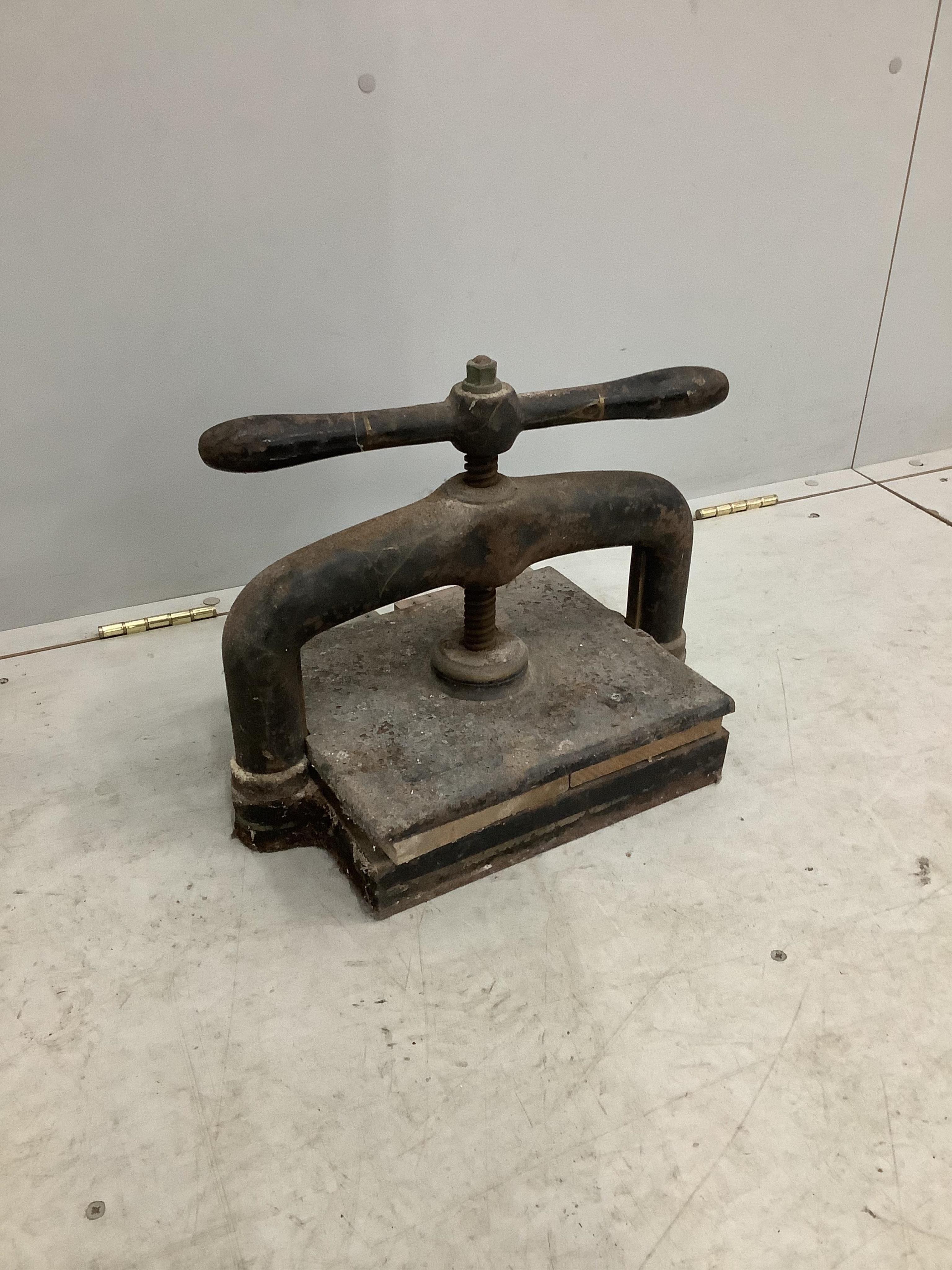 A Victorian cast iron book press, width 40cm, height 30cm. Condition - poor